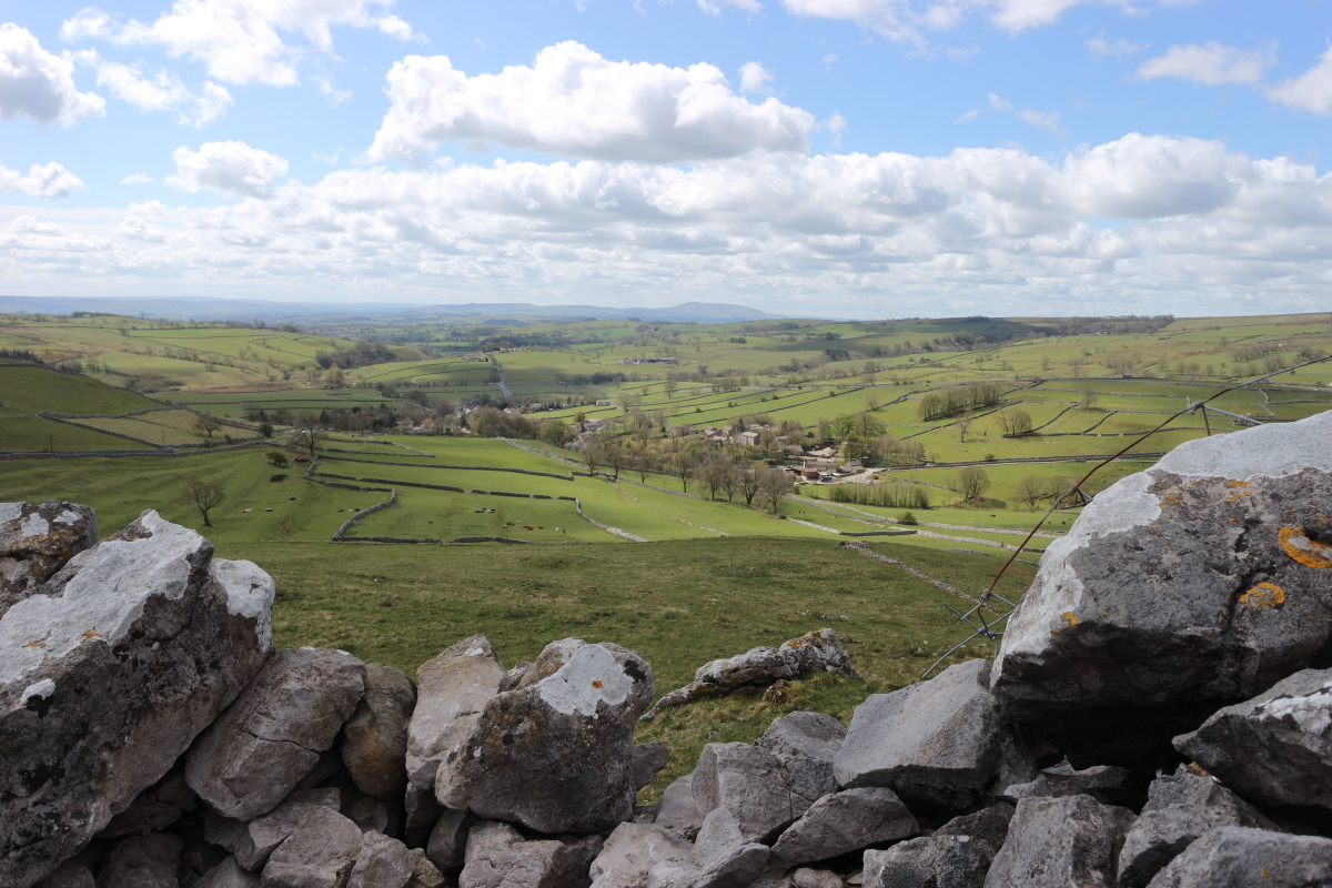 The village of Malham (Yorkshire, UK) and the surrounding countryside seen from higher ground to the North.